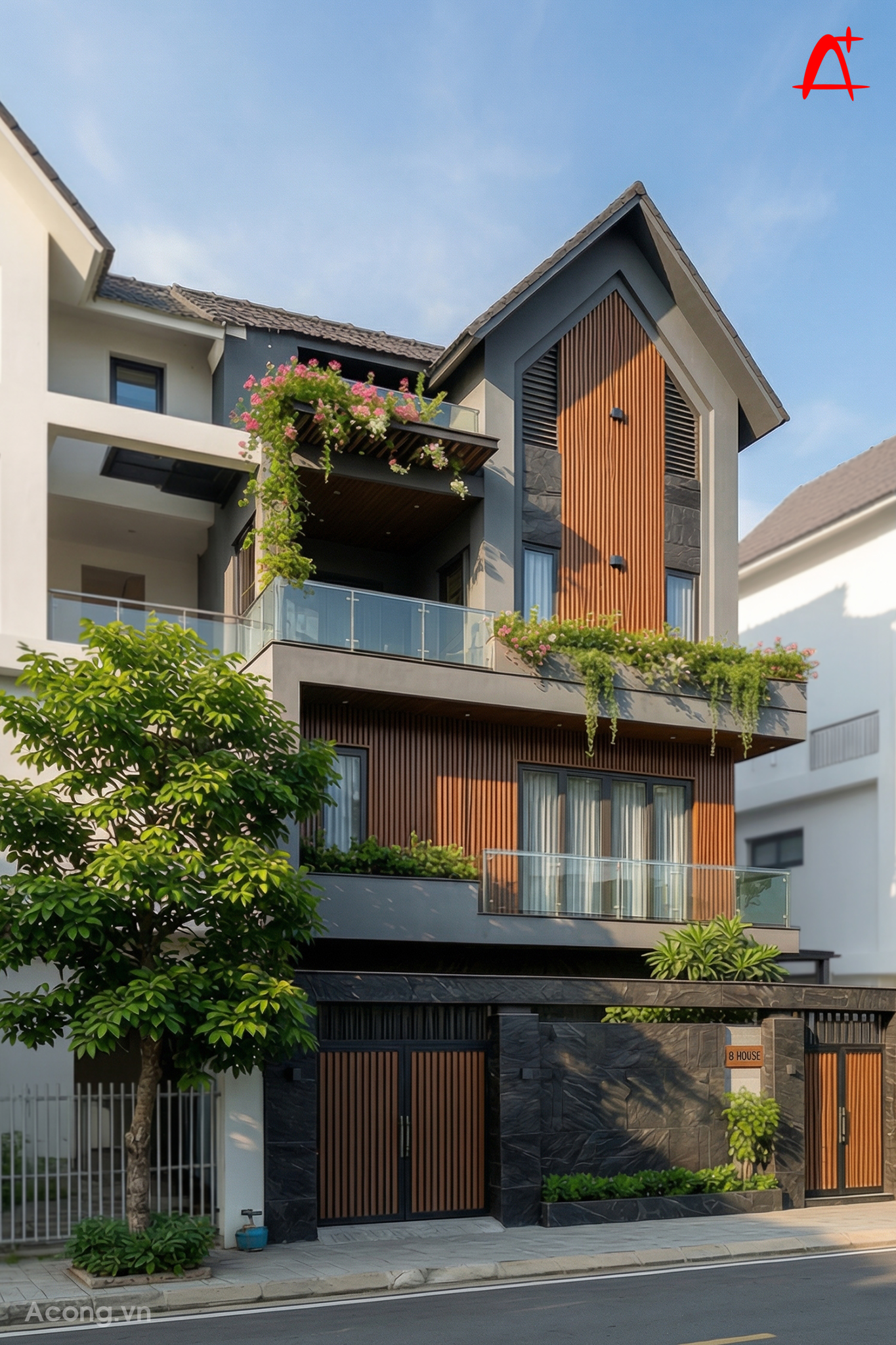 Mặt tiền biệt thự phố 3 tầng hiện đại với m&aacute;i dốc lớn, lam gỗ trang tr&iacute; v&agrave; hệ ban c&ocirc;ng phủ c&acirc;y xanh tạo điểm nhấn nổi bật giữa khu đ&ocirc; thị.